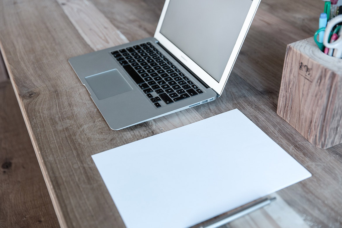 Notebook and wooden table